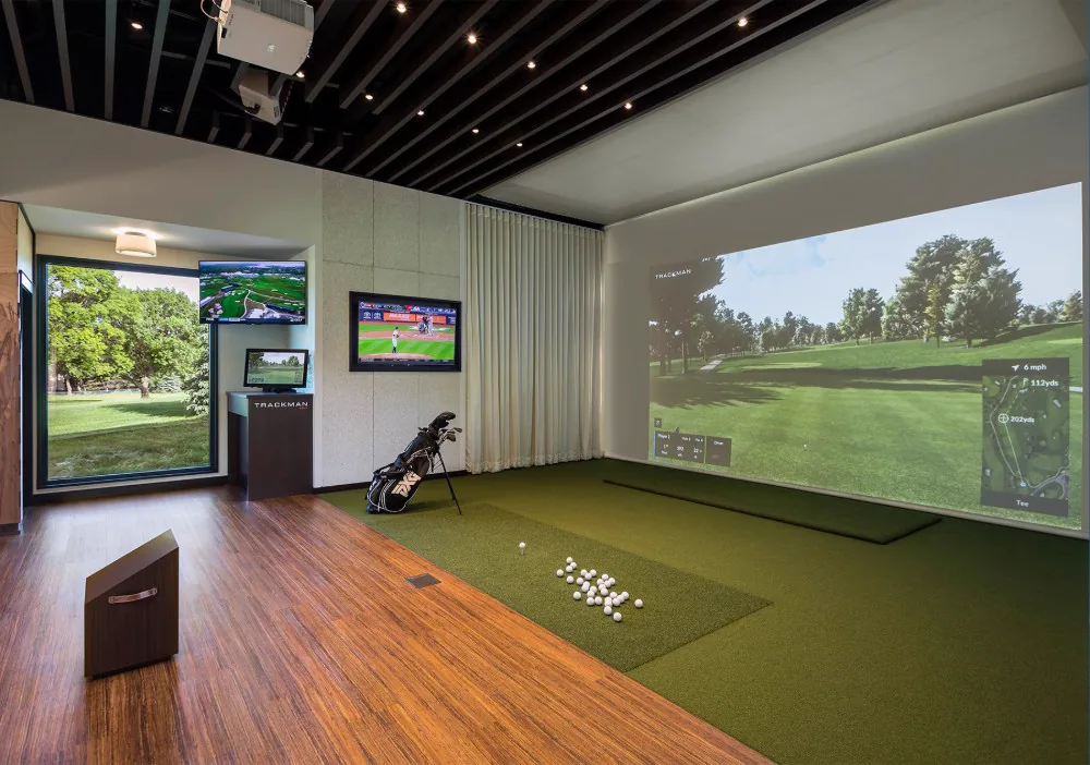 Screenshot Golf bay with the impact screen deployed for simulator play